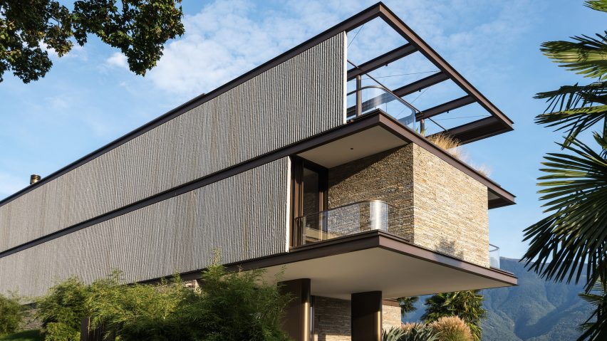 Exterior of rectilinear cantilevered house by KÃ¼chel Architects in Switzerland