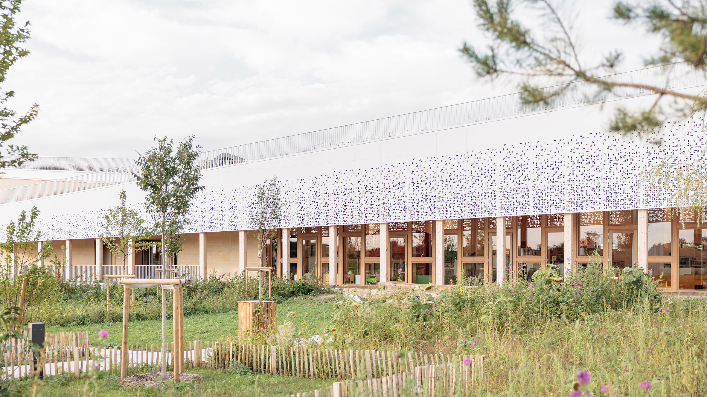 Atelier WOA creates long timber-framed library in France - Vimarsana News