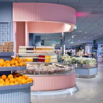 Pink curved counter inside Swedish supermarket ICA Stop