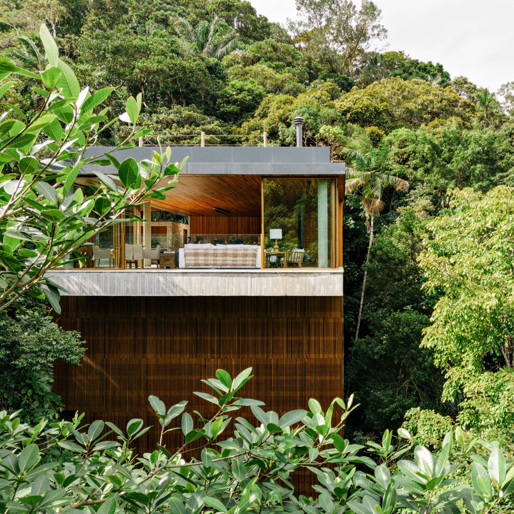 DB Arquitetos stacks house with wooden screens on Brazilian coast ...