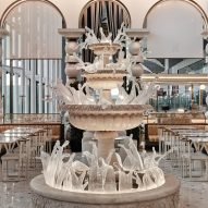 Four-tiered stone and glass fountain Istanbul Airport dining area