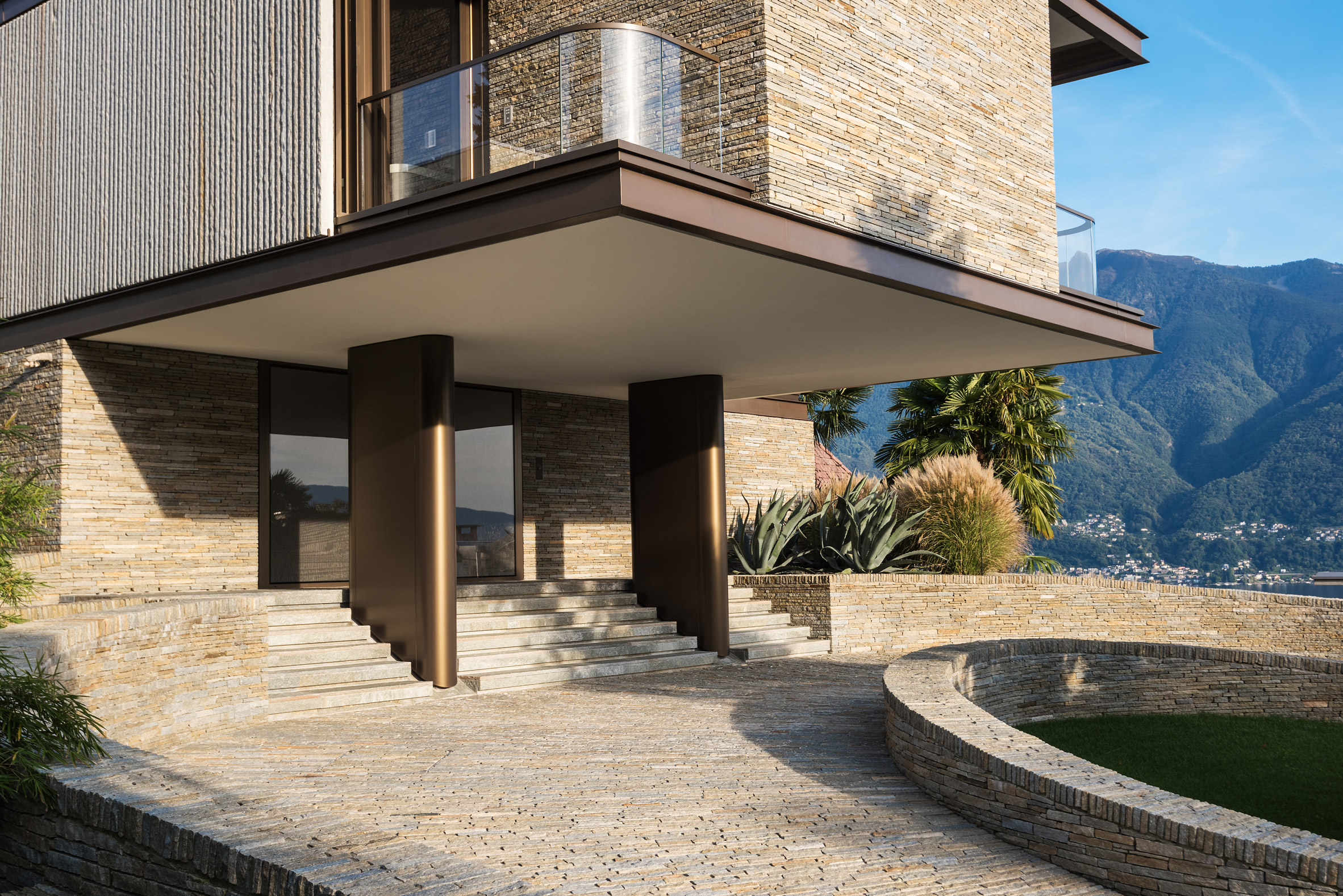 Exterior entrance of rectilinear cantilevered house by Küchel Architects in Switzerland