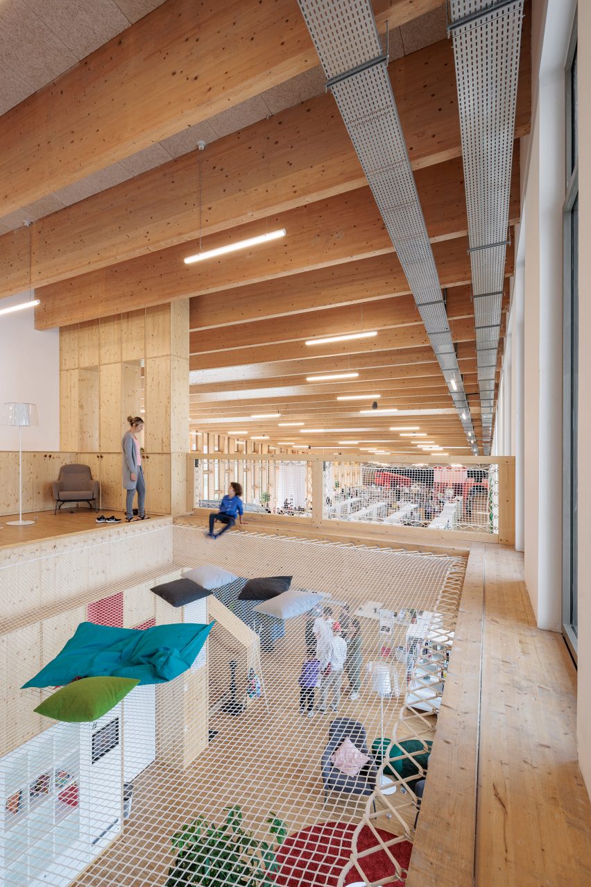 Play area within timber library in France by Atelier WOA