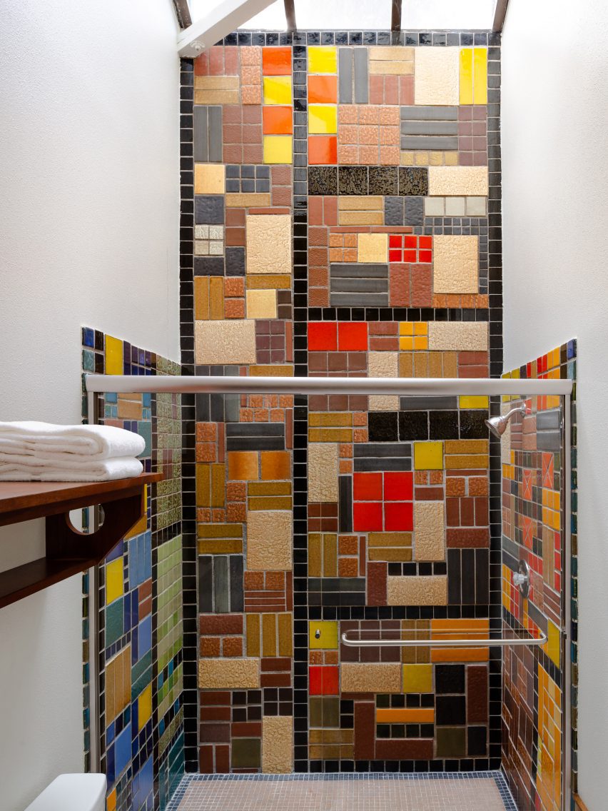 Shower with colourful patchwork of tiles from the 1960s