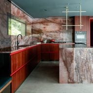 Kingston Lafferty Design includes "sensual" red quartzite kitchen in townhouse renovation