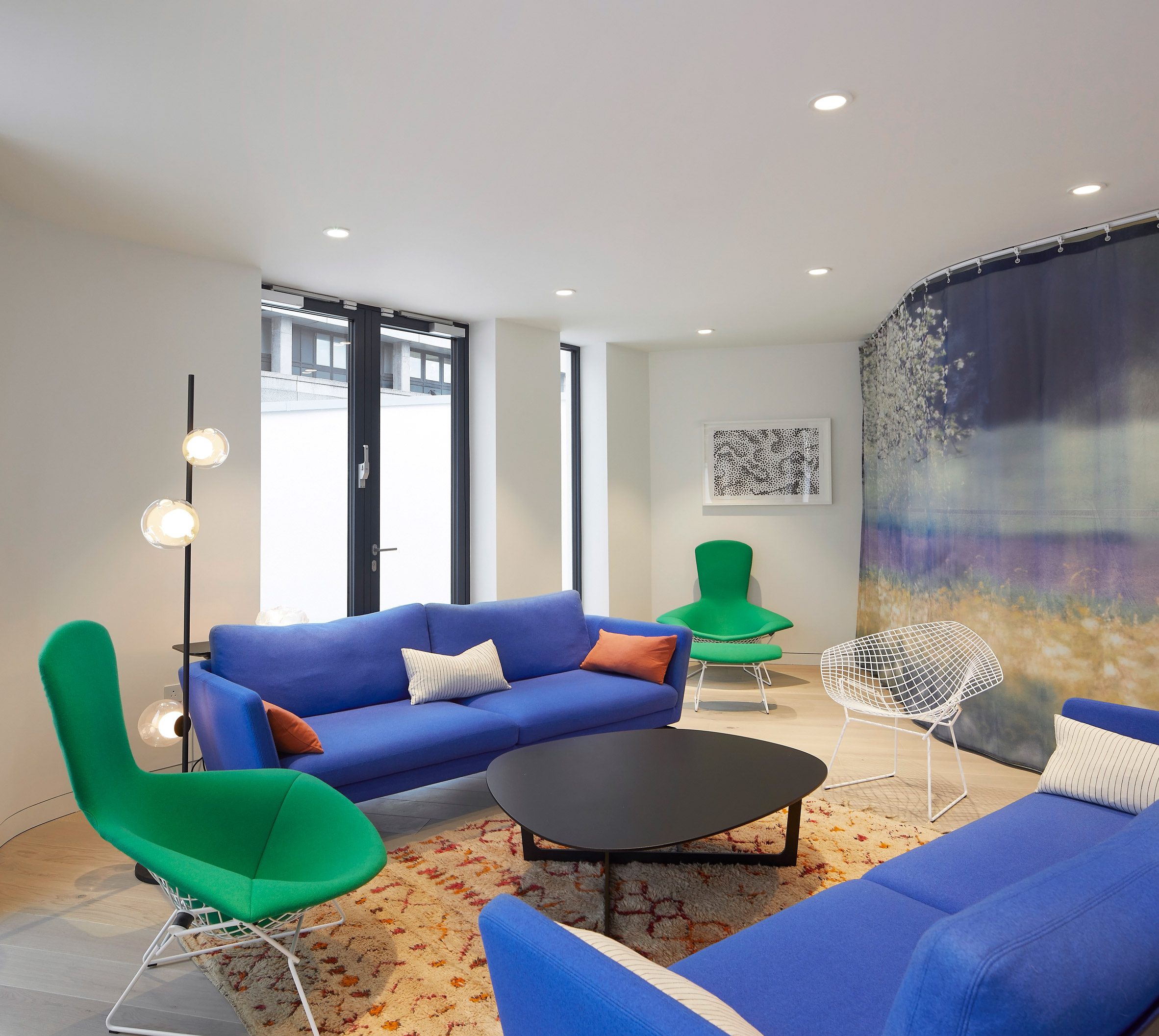 Lounge area with blue and green seating