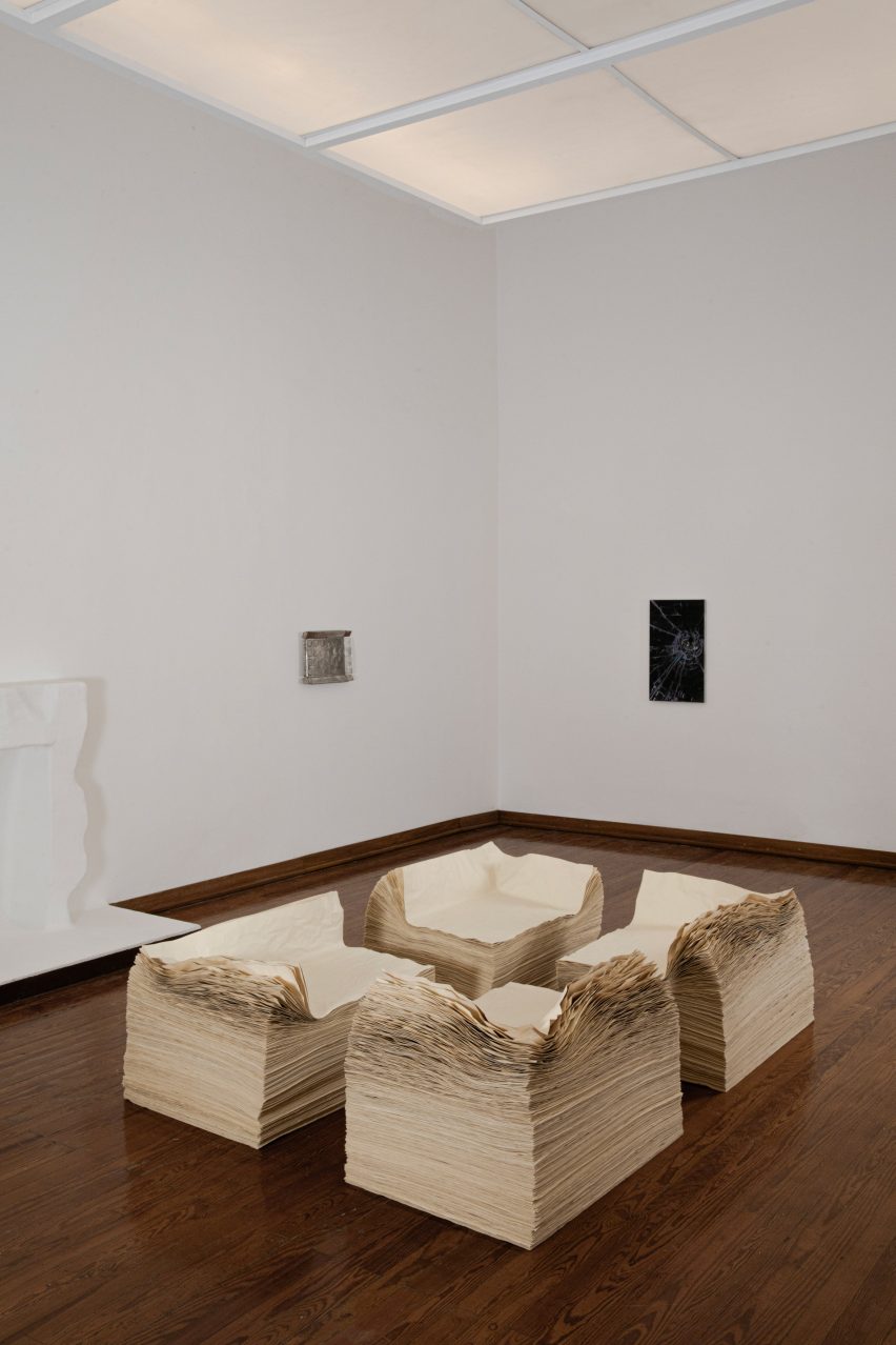 Brian Thoreen's paper chairs in white-walled gallery