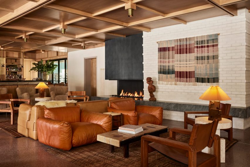 Lobby lounge at Mollie Aspen with earth-toned furniture and a gridded wood ceiling