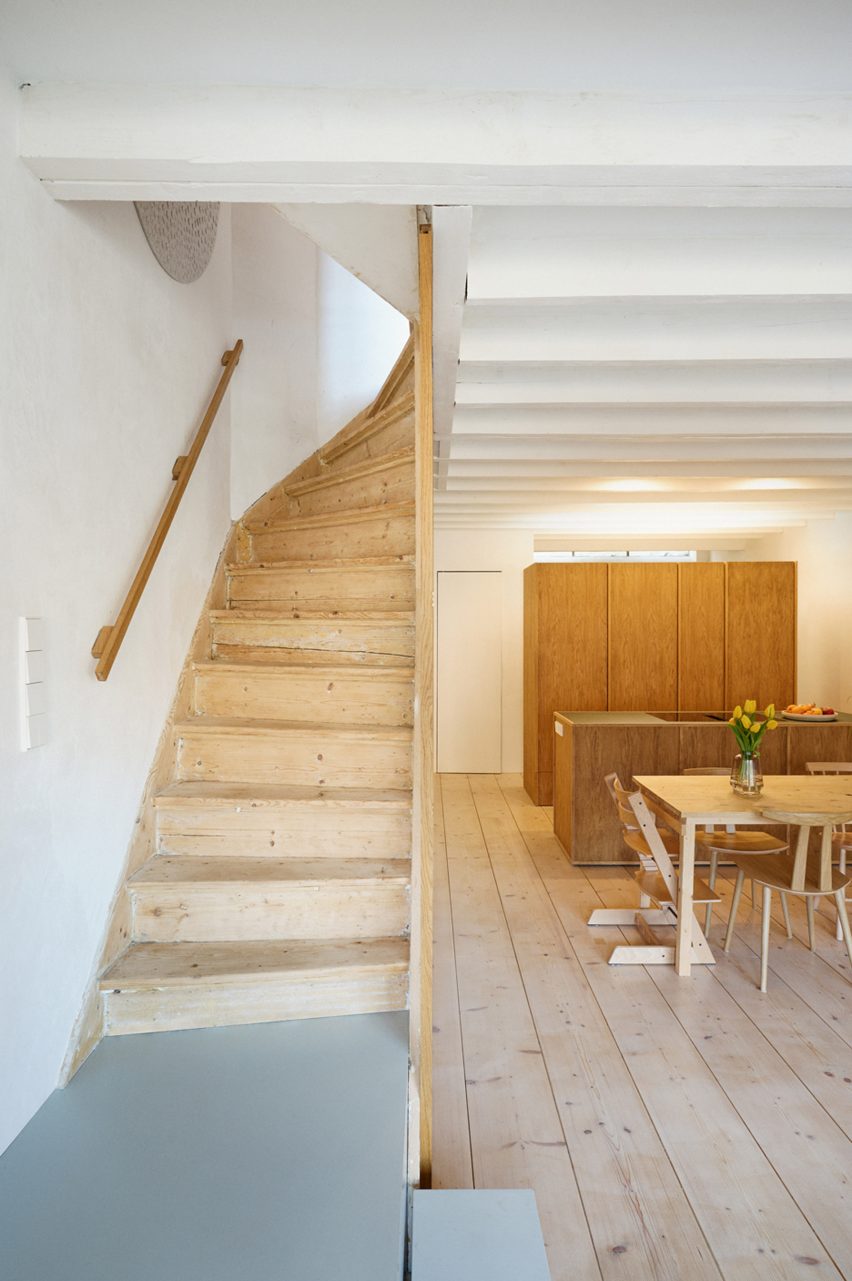 Wood staircase at Ulli Heckmann's compact apartment in Rotterdam