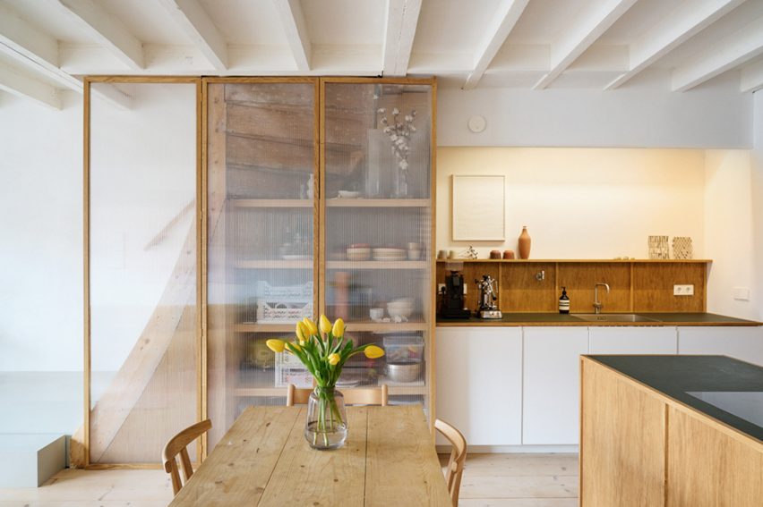 Kitchen and wooden fixtures at Ulli Heckmann's compact apartment in Rotterdam