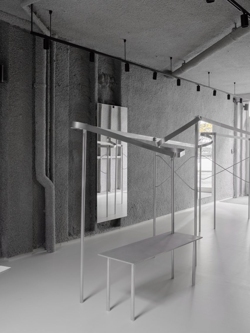 Display rails inside boutique in London by Mooradian Studio