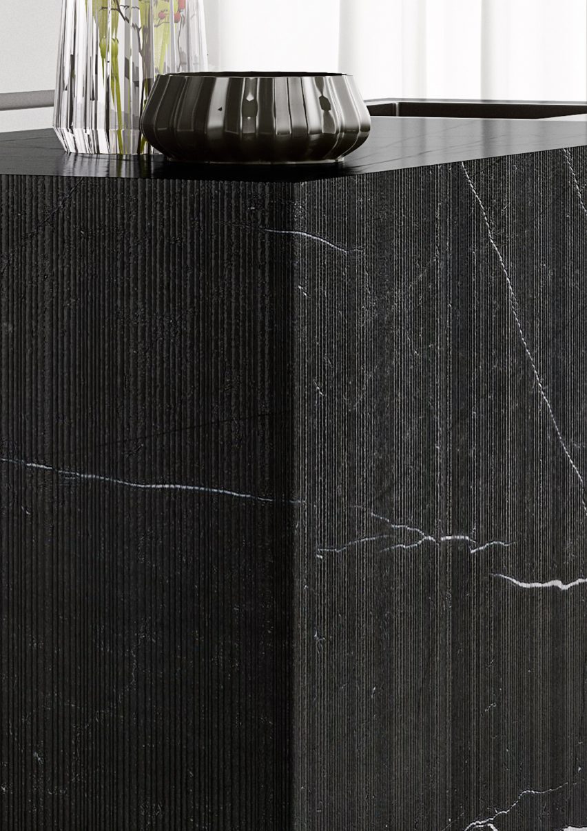 Close-up photo of a kitchen island made of New Marquina stone in a Bamboo finish by Antolini