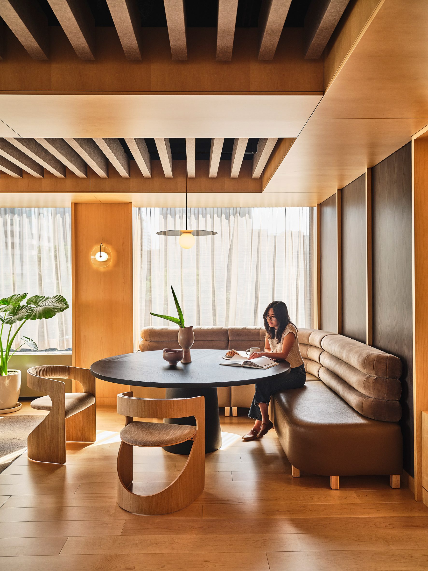 Workspace in the Gensler LA office with a banquette around a black circular table
