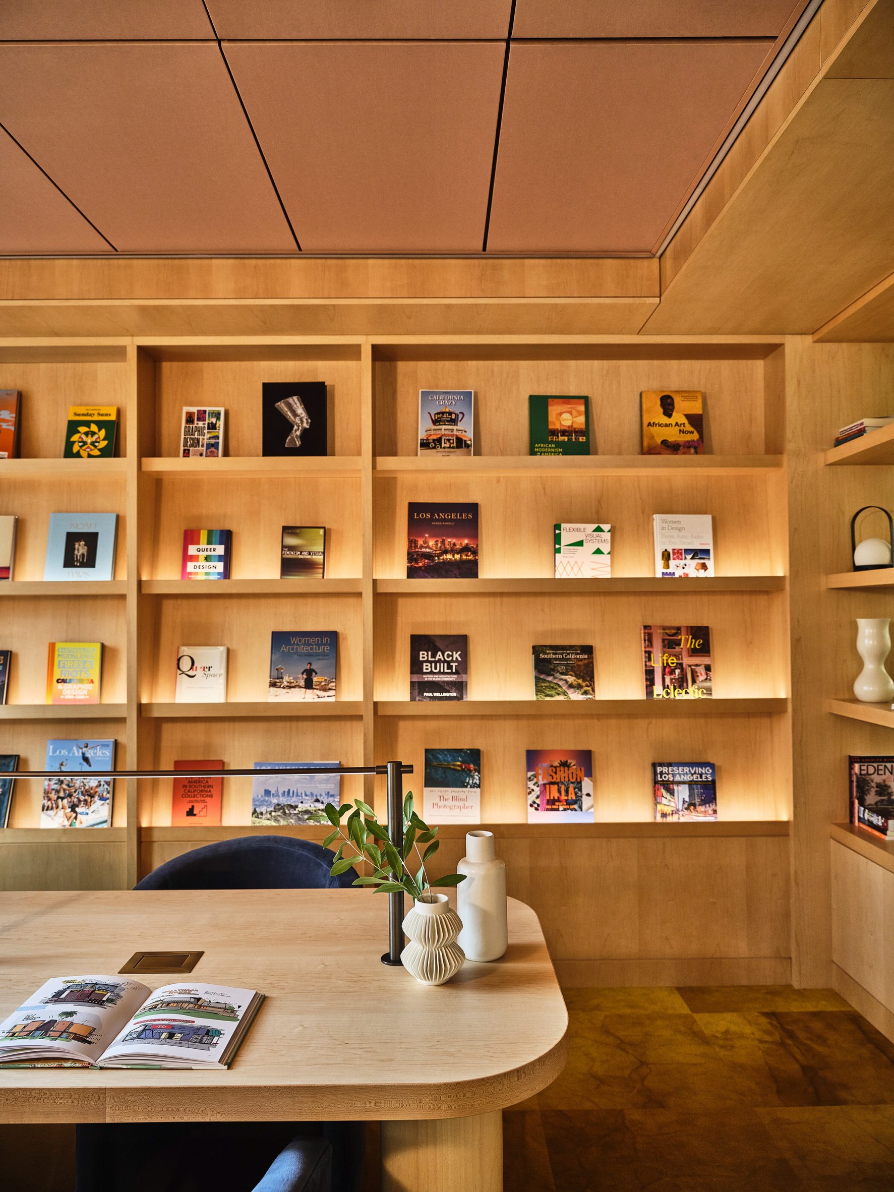 Open shelving with colourful books displayed 
