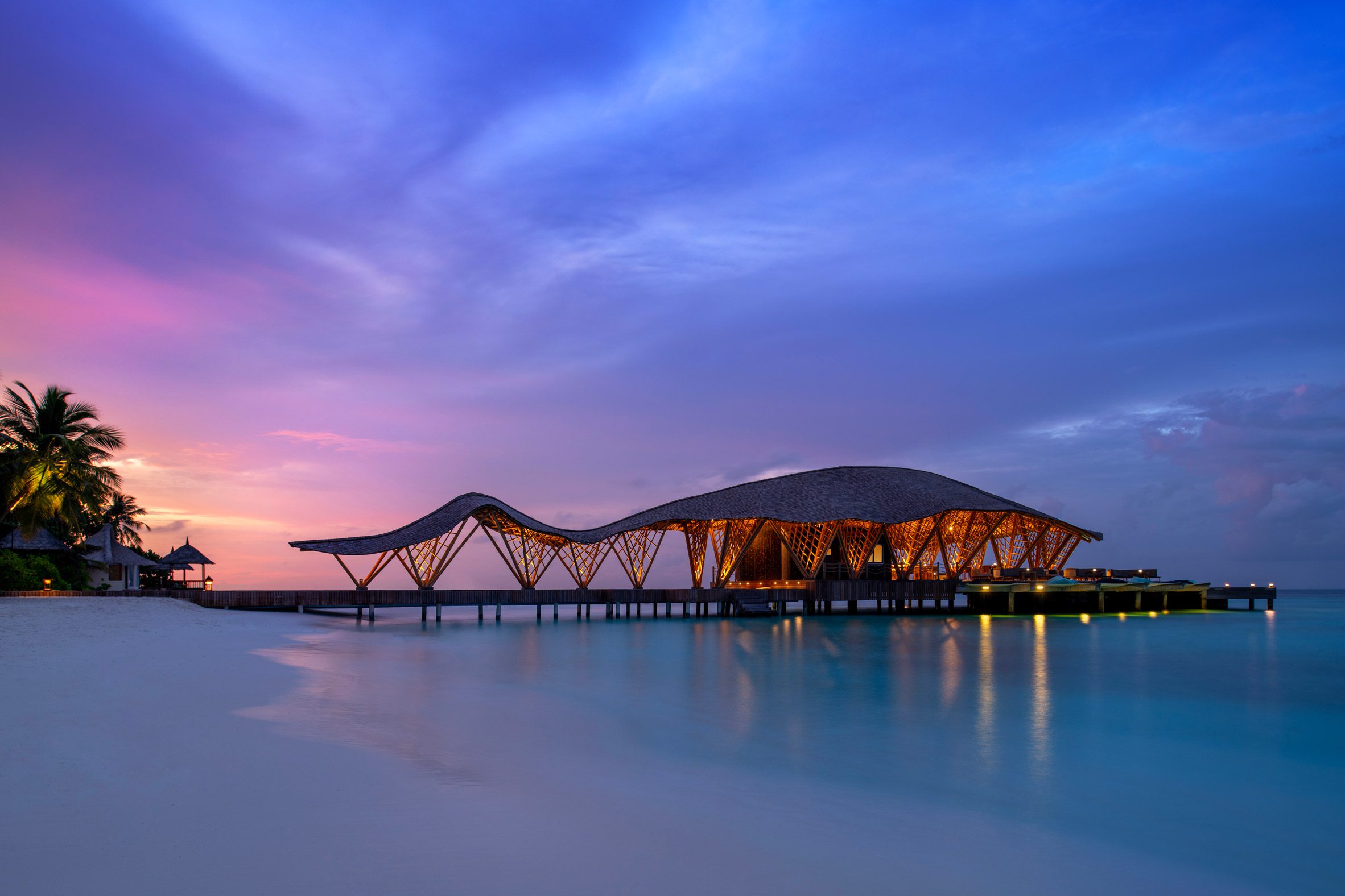 View of Overwater Restaurant at night by Atelier Nomadic