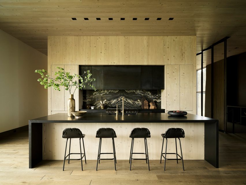 Kitchen with black stools