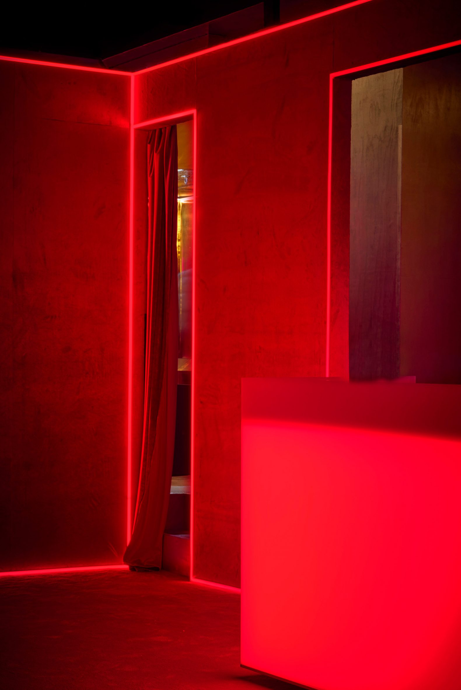 Interior with red lighting, walls and flooring