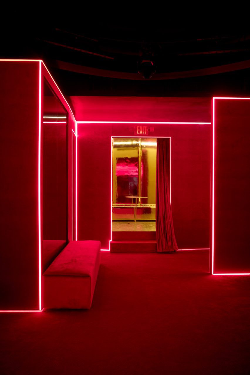 Nightclub interior with red carpet covering the walls and floor