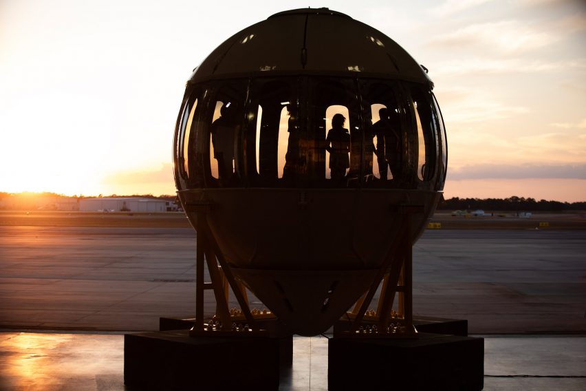 Backlit image of people standing in Excelsior test capsule