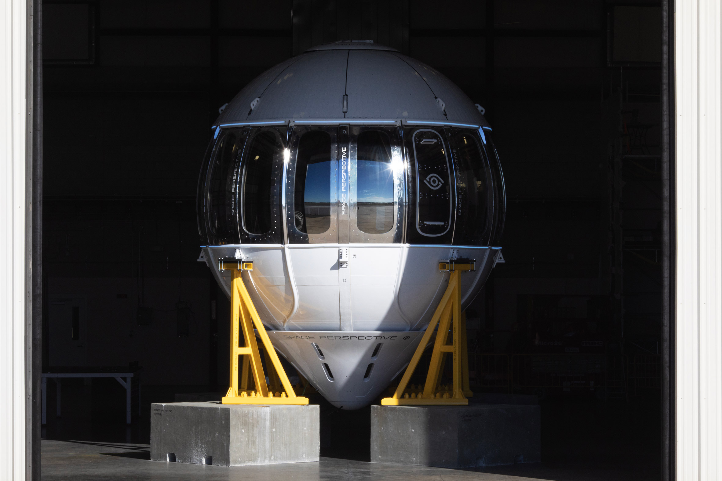Excelsior test capsule in a hangar