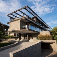 Küchel Architects crowns hillside in Switzerland with "architectural marvel"