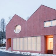Steiner Architecture finishes sculptural Clinic in Anif with wood-textured red concrete