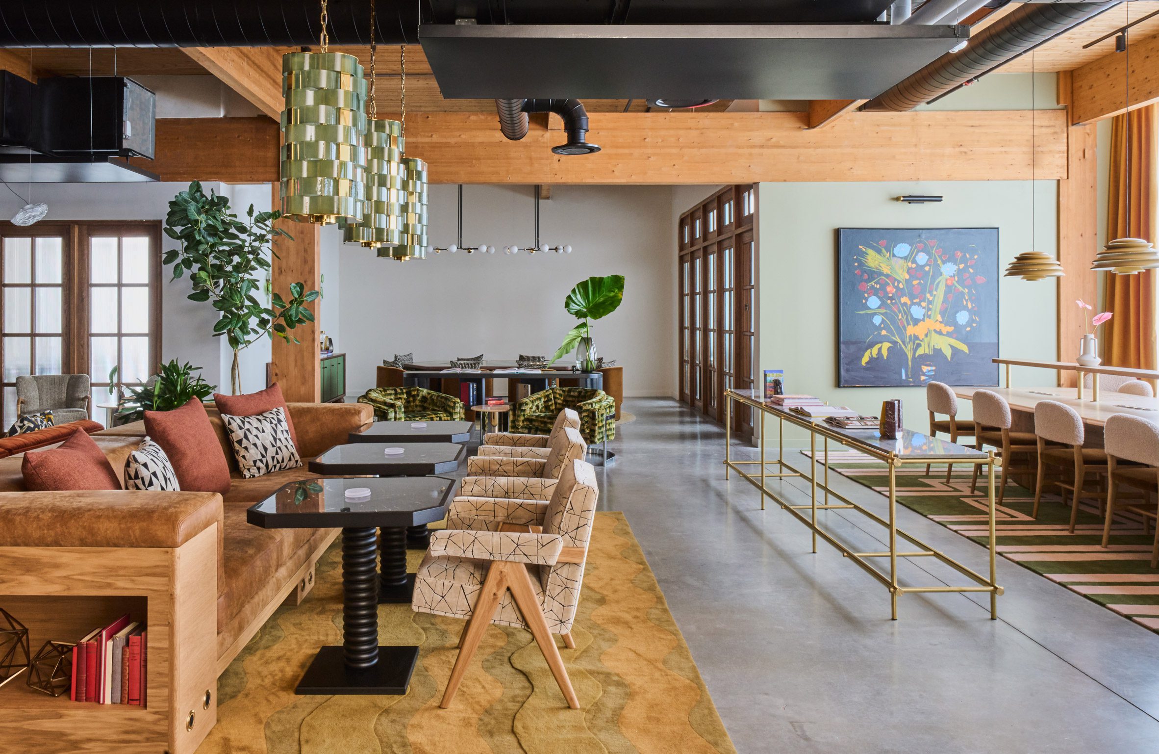 Open-plan space with sofas, armchairs and communal tables