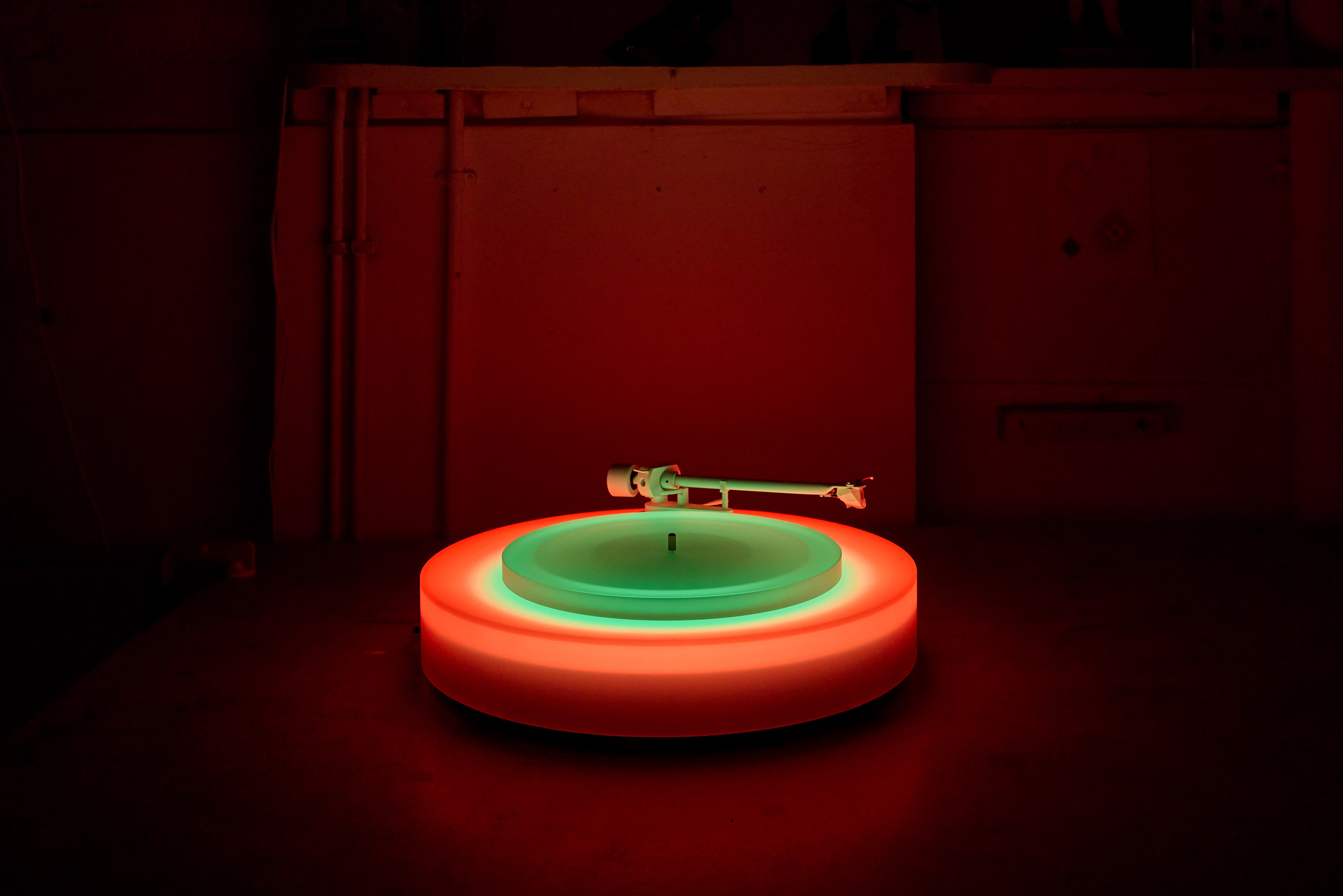 Green and red illuminated record player at Paul Stolper Gallery