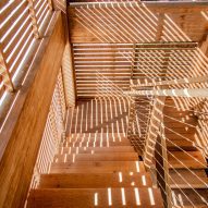 A sunlit wooden staircase