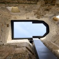 Medprostor tops 12th-century church in Slovenia with folding roof