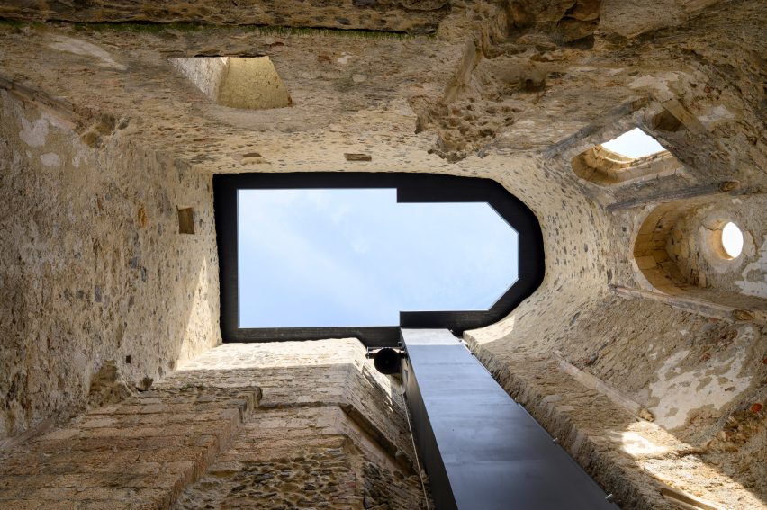 Open roof and ruins of the church at Žiče Charterhouse by Medprostor in Slovenia