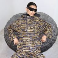 Person sitting on circular stool