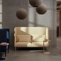 Blue and cream interior design display featuring seating and acoustic panels