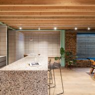 Kitchen with terrazzo counter of Addison Studios by Tigg + Coll Architects