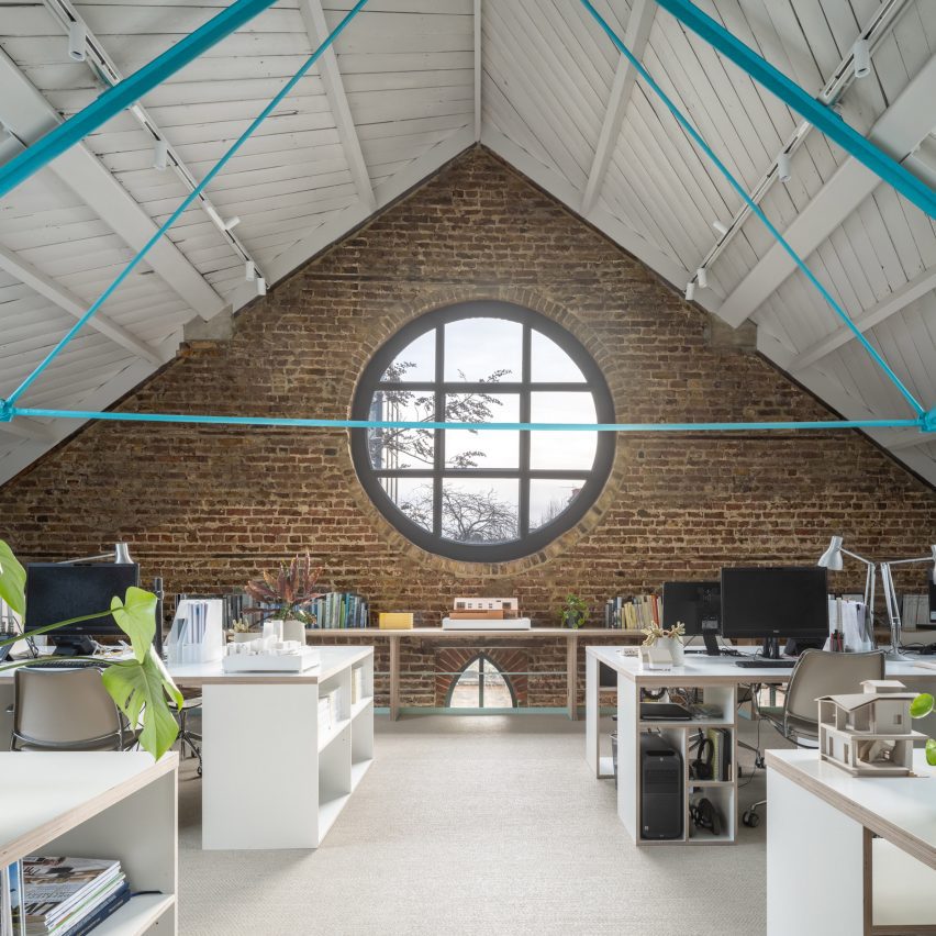 First floor workspace with rose window in Addison Studios by Tigg + Coll Architects