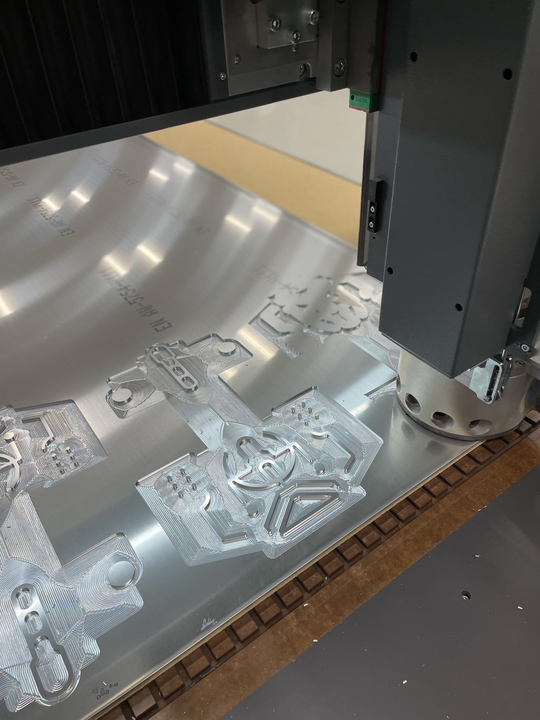 CNC milling machine cutting a piece of aluminium