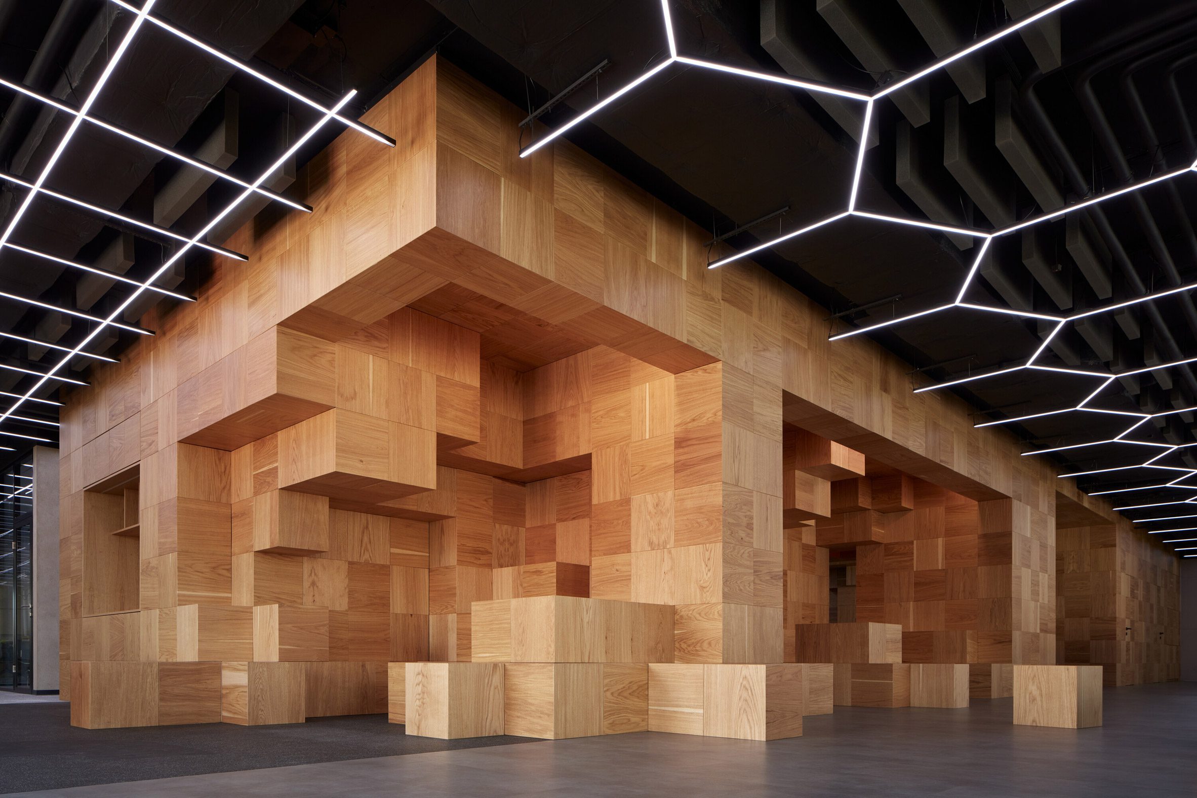 Wood structure and LED lighting in Pricefx office by Collcoll in Prague