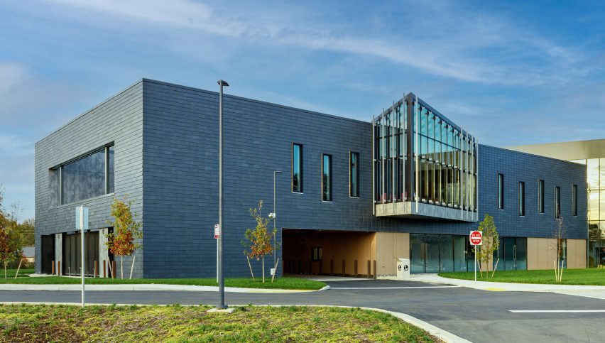 Modern building clad in slate with a glass projection