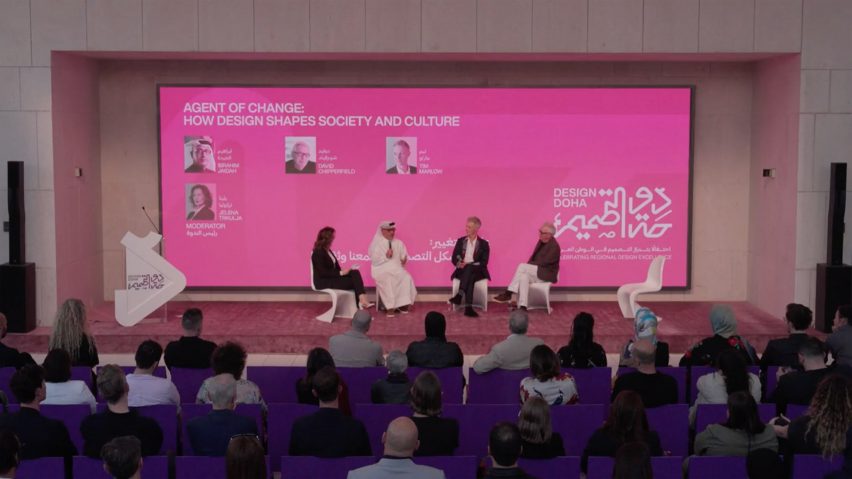 Video still of a panel of speakers on stage at Design Doha