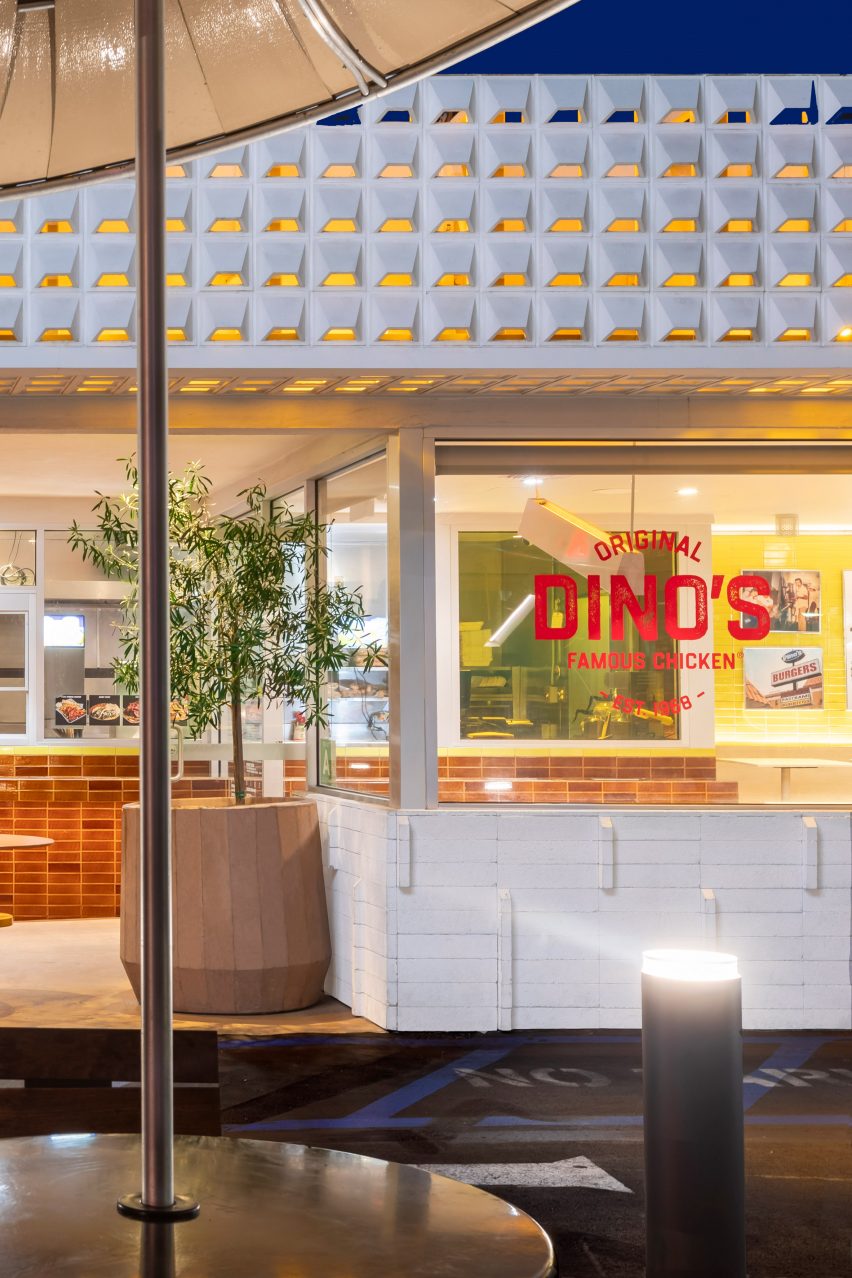 Exterior of Dino's Famous Chicken with red logo on the window