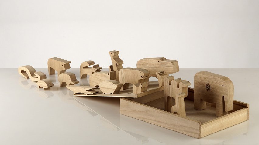 Wooden animals entering a wooden box