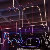 Neon outlines of animals suspended from the ceiling