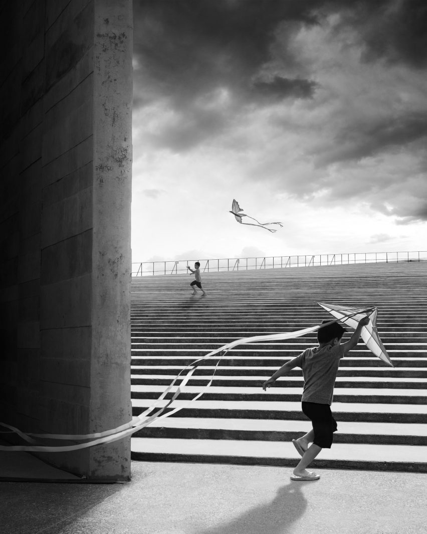 A striking photo of a boy flying a kite playing on the steps of the Teopanzolco Cultural Center in Mexico