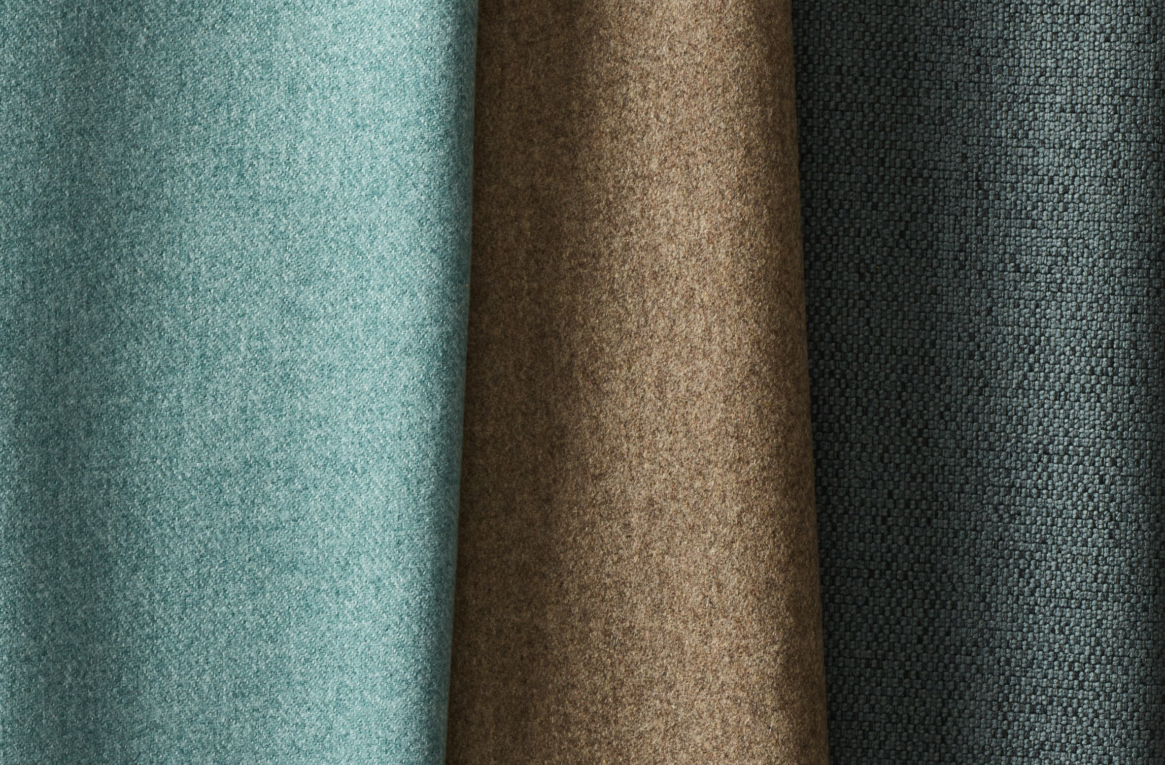 Photo of three different fabrics from Carnegie's Go-To collection