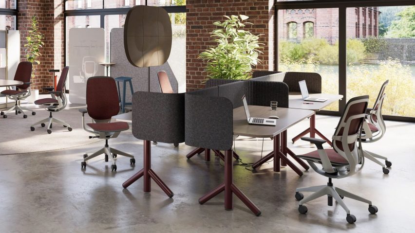 Red Steelcase Karman chairs in an office
