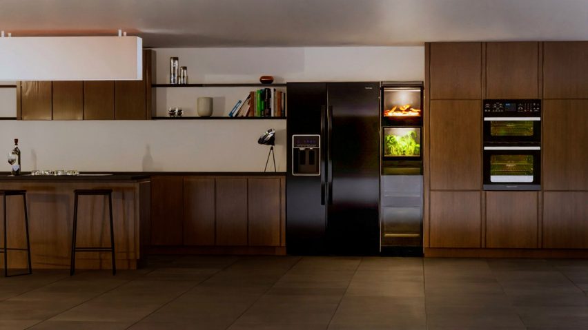 Kitchen with fridge beside indoor growing appliance