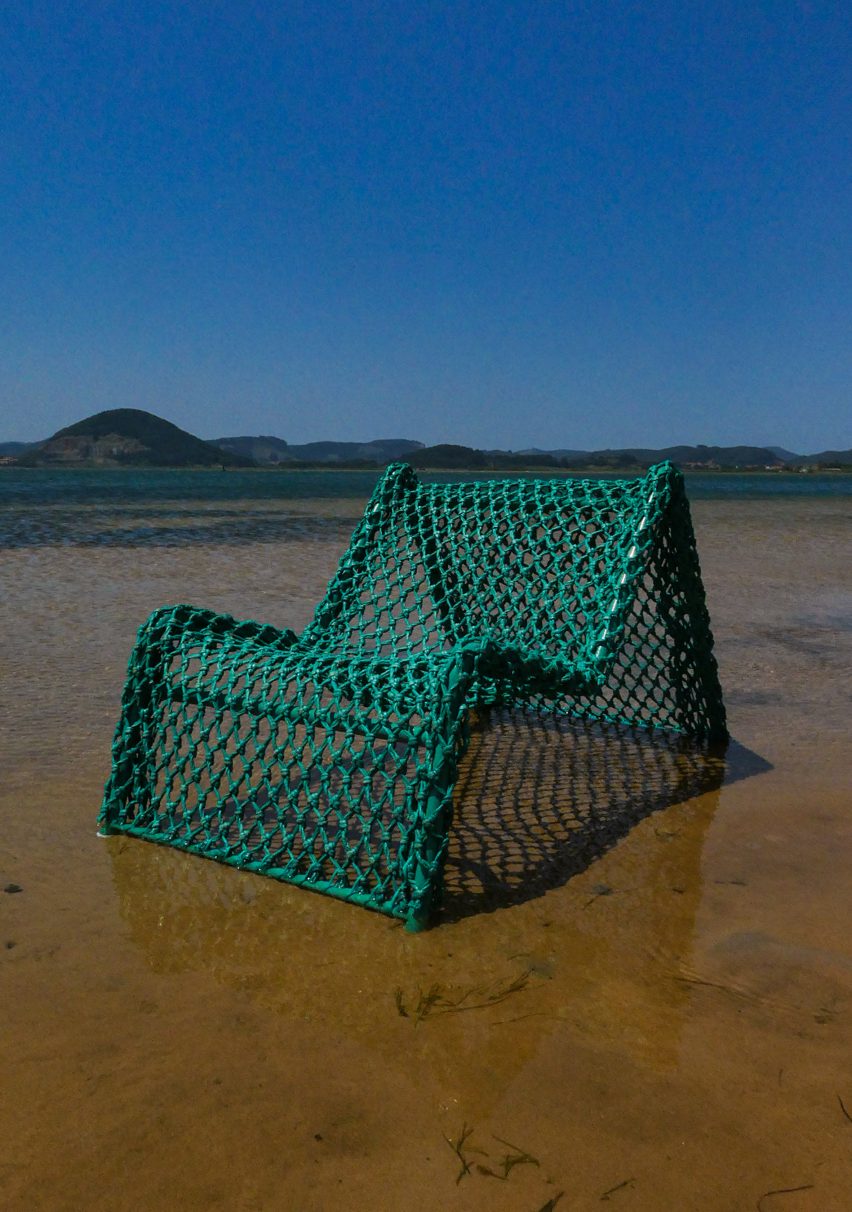 Green chair on a beach