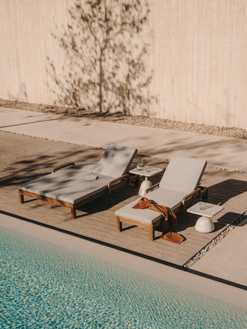 Sun loungers by a pool
