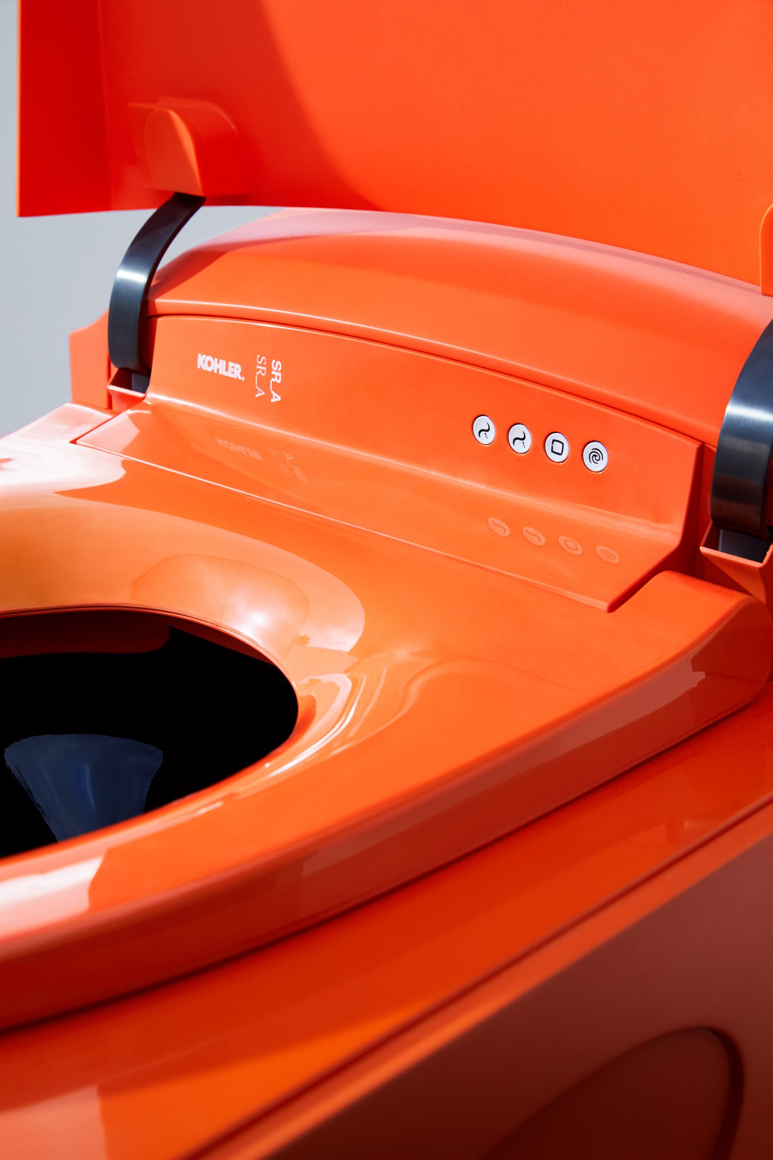 Close-up of orange toilet seat