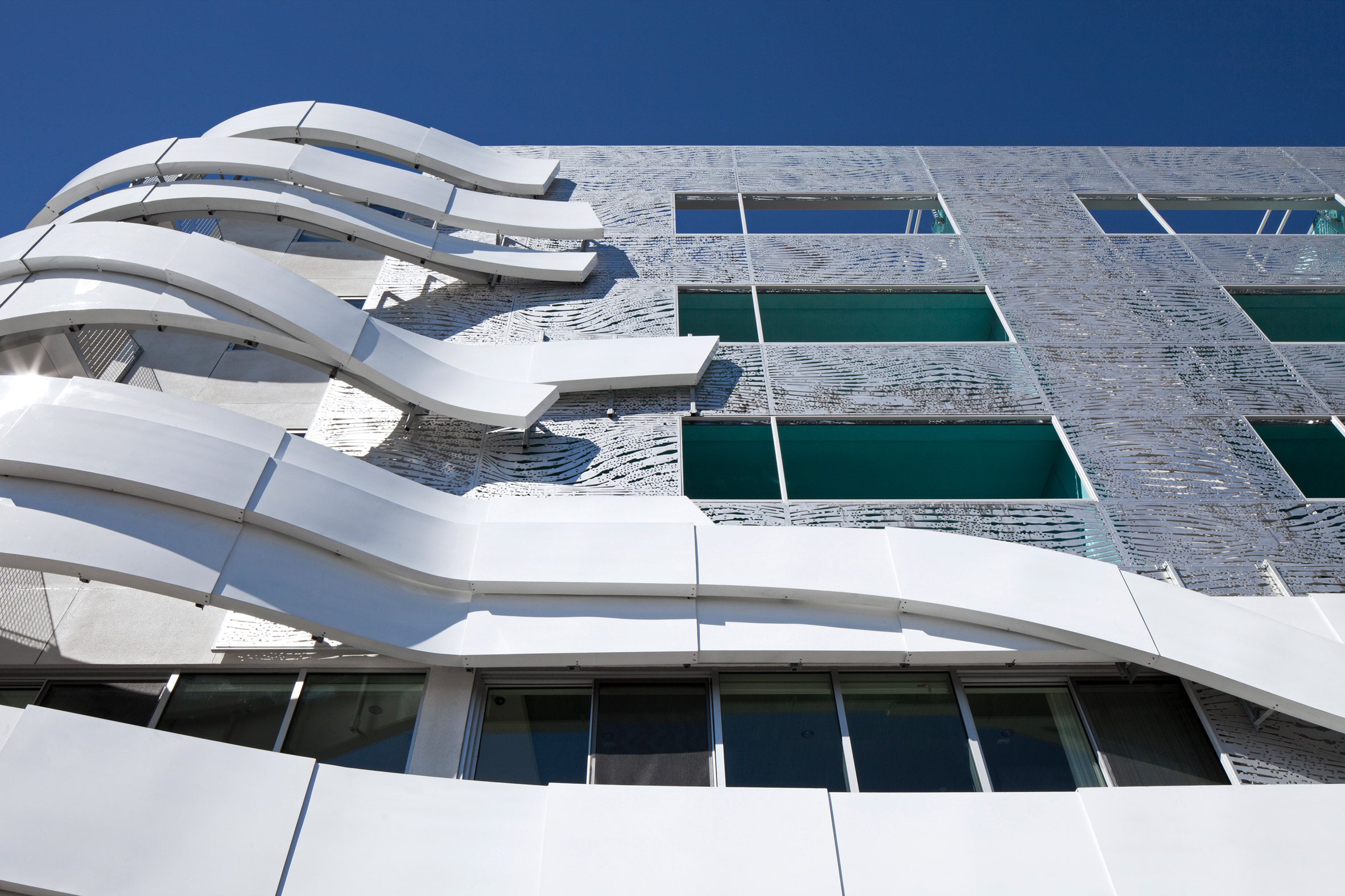 Metal ribbons attached to building corner